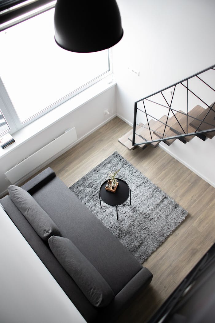 Aerial view of a stylish minimalist loft with modern furnishings and elegant decor.